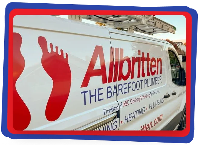 A white van with red and blue lettering that reads “Allbritten THE BAREFOOT PLUMBER.” The logo includes two red footprints. A ladder is mounted on the roof; the van advertises plumbing, heating, and cooling services.