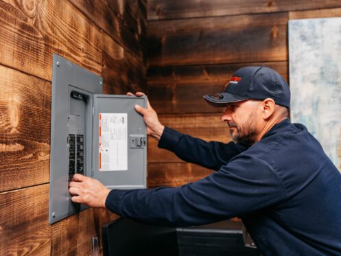 Allbritten Electrical Technician Servicing and Upgrading an Residential Electrical Panel on the Interior of a Home