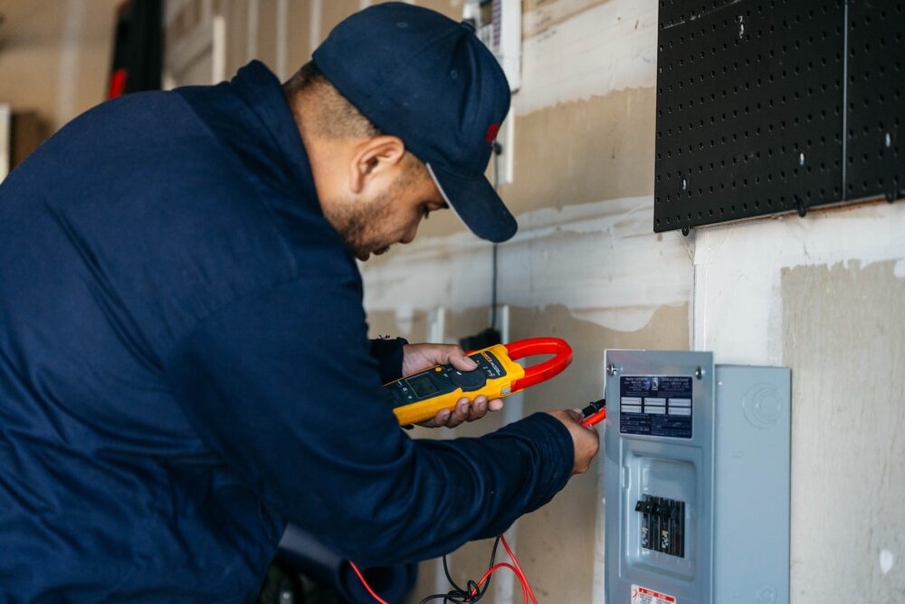 Allbritten Electrician testing home's electrical before installing EV charger