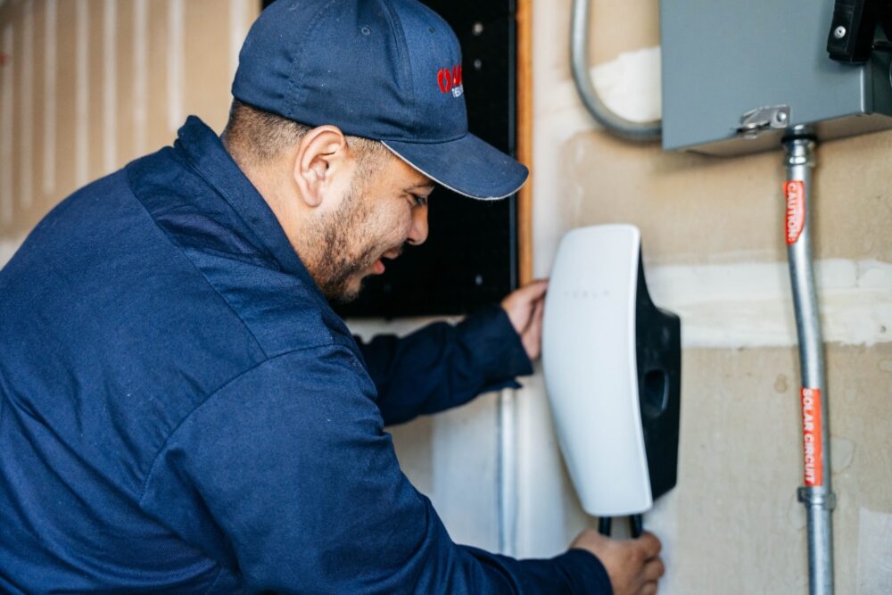 Electrician installing Tesla EV Charger 